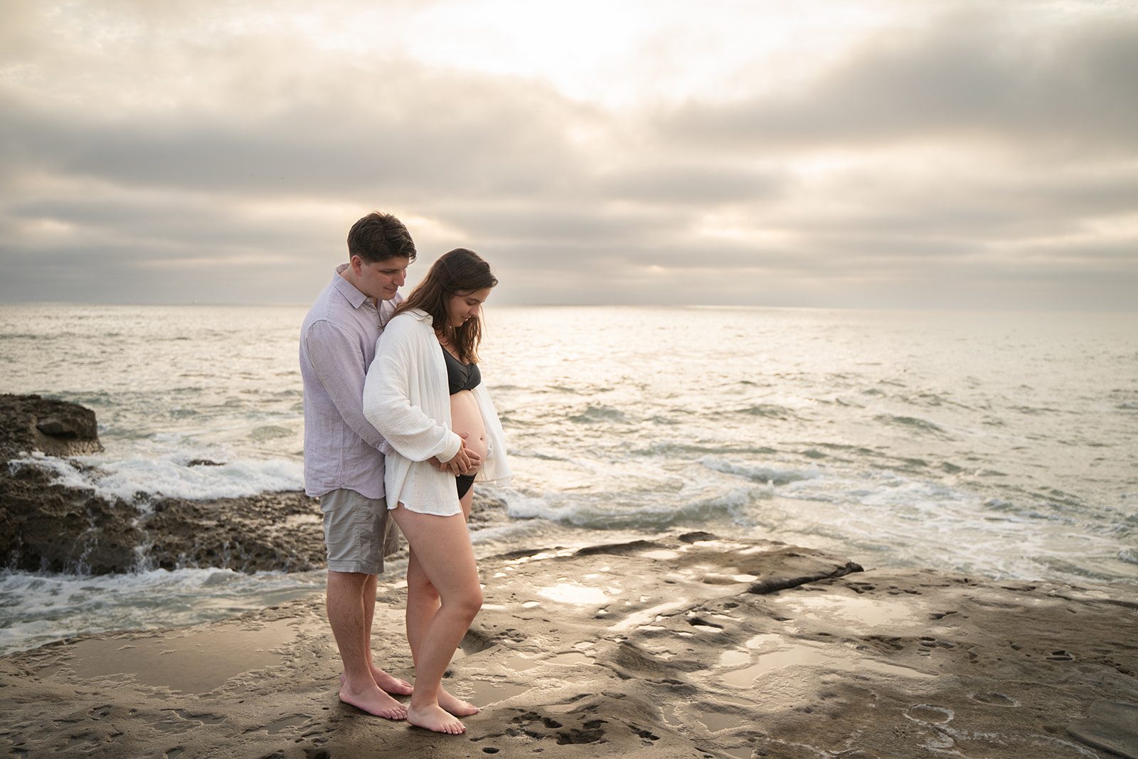 Expecting couple on the beach at sunset during a San Diego maternity session