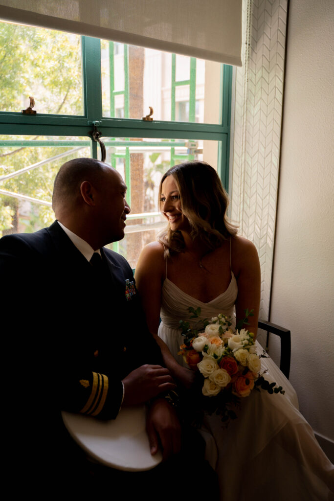 Couple looking at each other at San Diego courthouse elopement.