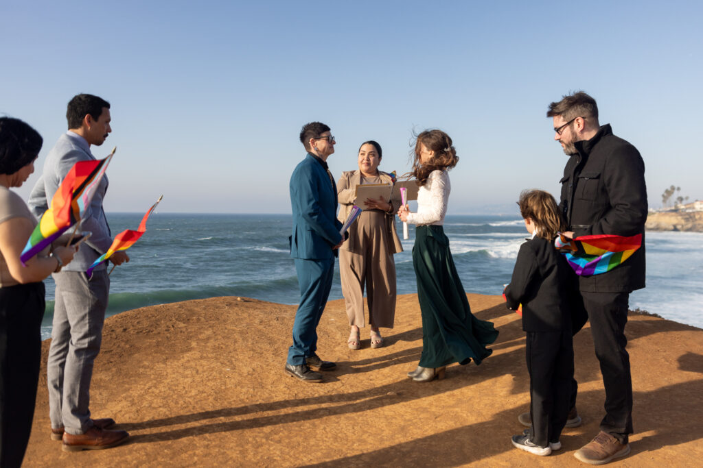 LGBTQ+ couple stands at the altar for Sunset Cliffs wedding