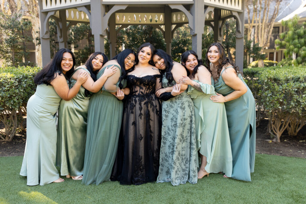 Bridesmaid group photo of everyone hugging at Carlsbad Windmill Wedding