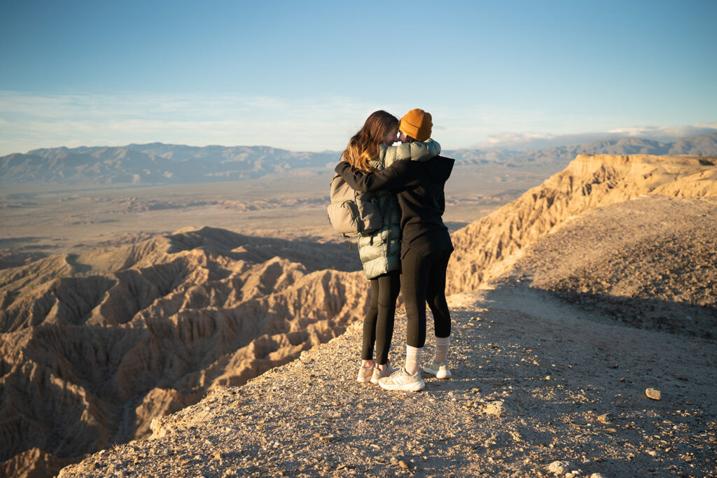 Couple looks at each other while hugging at Fonts Point Anza Borrego