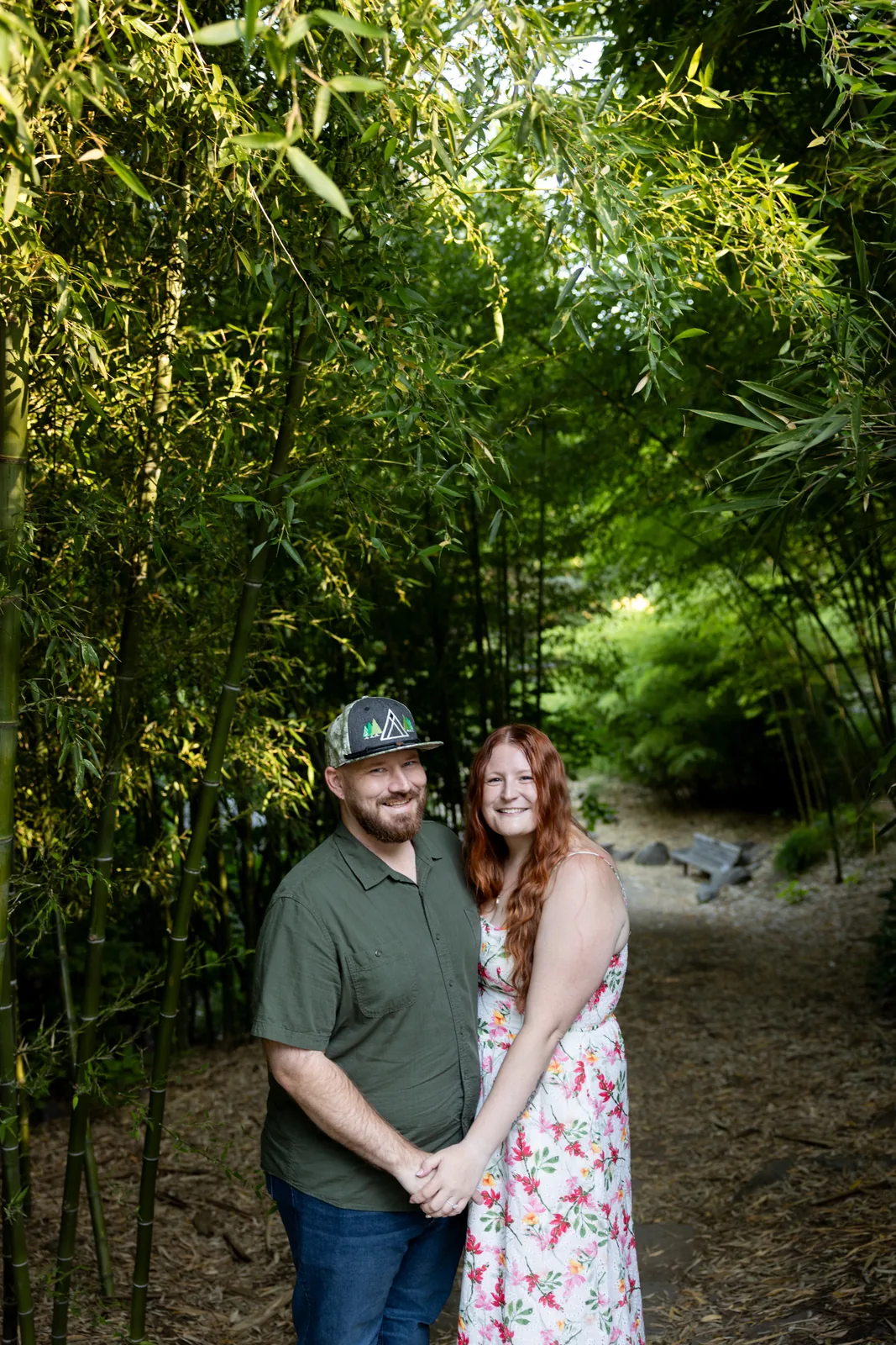 Couple laughing together in a bamboo grove in Portland
