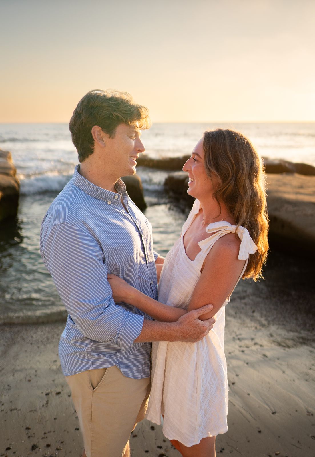 Couple hugging on beach in La Jolla