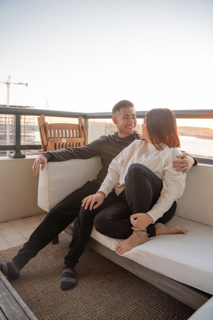 Couple sitting on San Diego patio overlooking bay